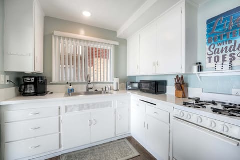 Coastal kitchen with coffee maker and essentials