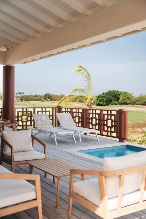 A peaceful terrace made for unwinding, featuring cozy seating, sun loungers, and a refreshing private plunge pool.