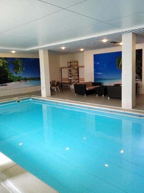 Dive into a serene indoor pool for year-round relaxation.