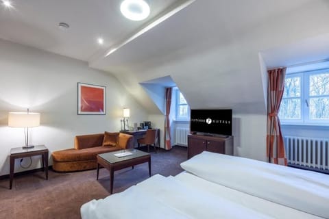 Wake to soft daylight and relax in your private seating corner.