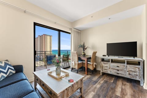 Your spacious living room opens to breathtaking ocean views through floor-to-ceiling windows, creating the perfect spot to unwind.