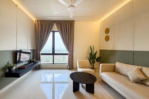 The bright & airy living area with a 3-seater couch.