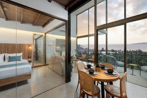 Deluxe Suite, Balcony, Ocean View | In-room safe, desk, laptop workspace, blackout drapes