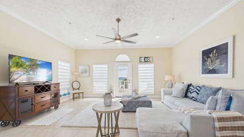 Open concept living area with comfortable furnishings and scenic views of the gulf