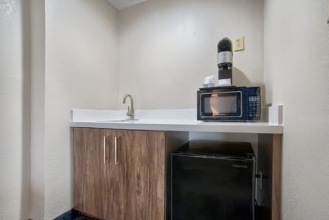 Suite, 1 King Bed (Extra Floor Space) | Desk, laptop workspace, blackout drapes, iron/ironing board