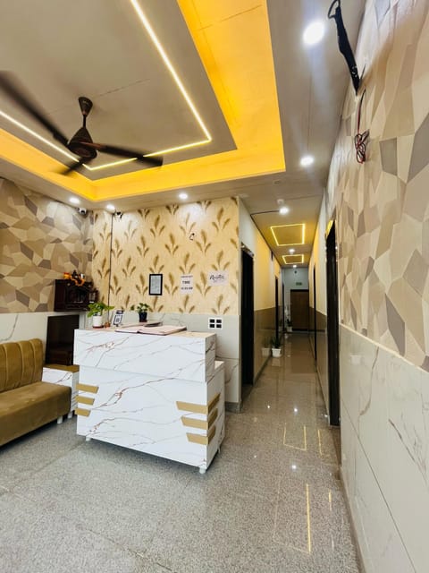 Deluxe Double Room, Balcony, City View | Living area | LED TV