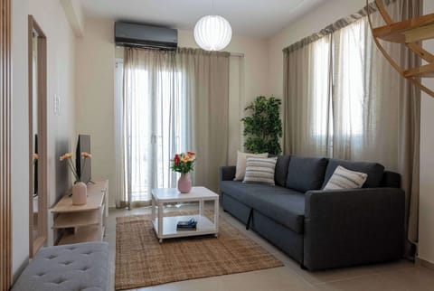 Bright Living Room with Sofa, TV, and Natural Light