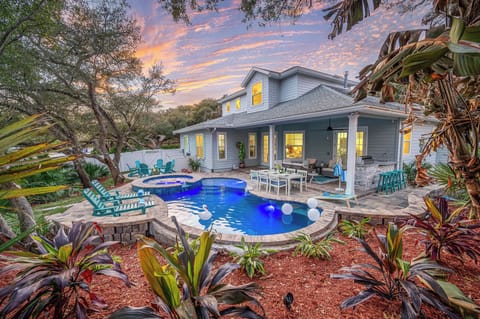 Resort-style backyard pool, spa, fire pit, and relaxing patio seating