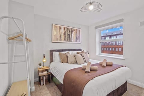Chic Bedroom Retreat: Bright, modern space with plush bedding and stylish decor awaits your stay!