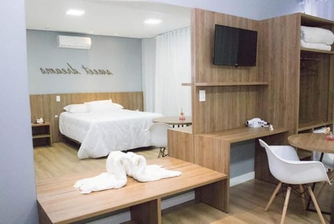 Deluxe Suite, Patio, City View | Minibar, laptop workspace, soundproofing, iron/ironing board