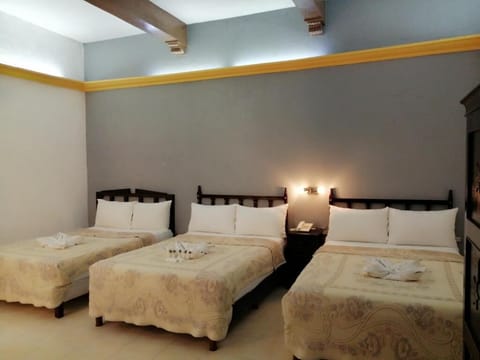 Settle in together with multiple beds and cozy linens.