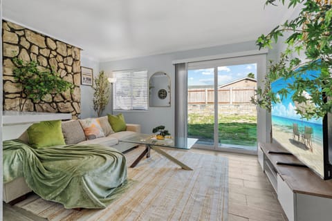Relax on the couch, or step straight out to the backyard from the living room