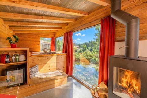 Cozy interior with fireplace and panoramic lake view