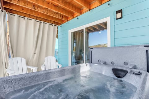 Soak in the hot tub while enjoying panoramic countryside views