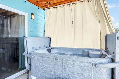 Soak in the hot tub while enjoying panoramic countryside views