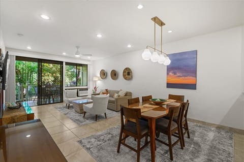 Bright dining area with seating for six and beautiful island decor