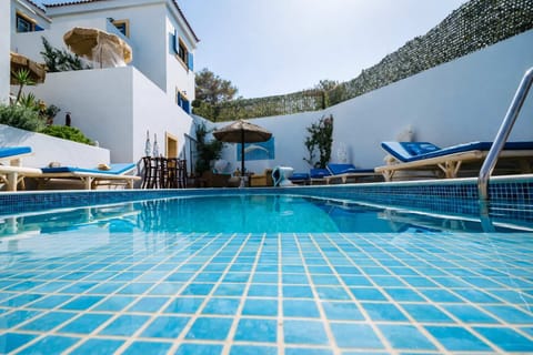 Large shared pool with sun loungers