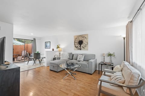 Settle into your beautifully appointed living space where modern comfort meets warm elegance. You'll love the open floor plan flowing to your private patio, perfect for morning coffee or evening relaxation.