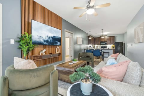Bright open living area with smart TV and stylish seating