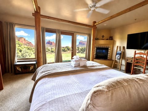 Bedroom with views and fireplace