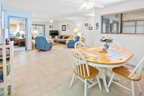 Enjoy this open-concept beach stay featuring a bright dining area and comfortable living room with coastal décor. Relax, dine, and unwind after a fun-filled day at the beach in this inviting vacation rental retreat.