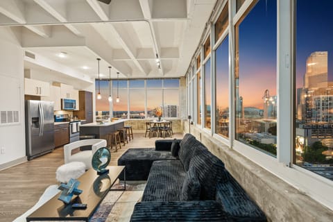 Unwind with panoramic skyline views and natural light pouring in. The perfect space to relax after a day downtown or enjoy a cozy evening with your favorite show.