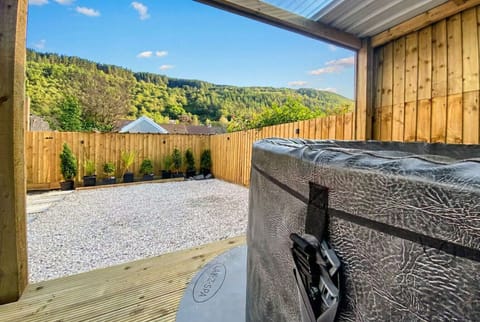 For stays longer than 1-night soak in the bubbling hot tub while forested Welsh hills stretch out before you.