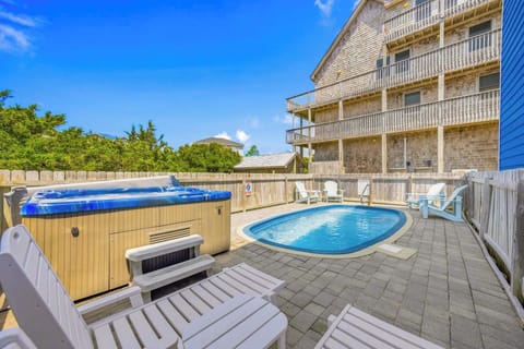Your private backyard retreat awaits, complete with a sparkling pool and bubbling hot tub—perfect for sun-soaked afternoons and starlit evenings.