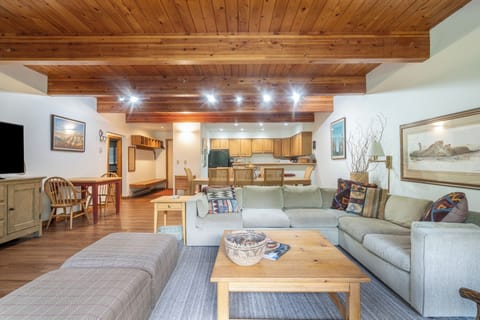 Settle into your inviting open-concept living space, where warm wood beams and abundant natural light create a relaxed mountain retreat. Unwind on plush seating, enjoy meals together, and make lasting memories in this thoughtfully designed home.