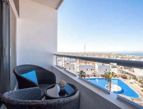 You'll have beautiful bay & ocean views & a glimpse of one of the pools below too!