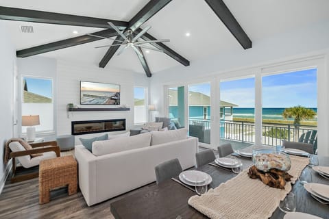 Spacious ocean-view living room with vaulted ceilings and large windows overlooking the Atlantic