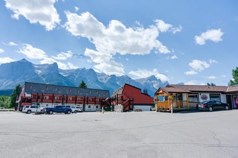 Grounds open onto the Rocky Mountain landscape — ski locker storage and bike rentals on-site