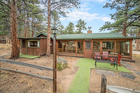 Cozy cabin retreat with spacious porch and forest views