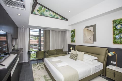 Well-designed boutique room with king bed and modern finishes.