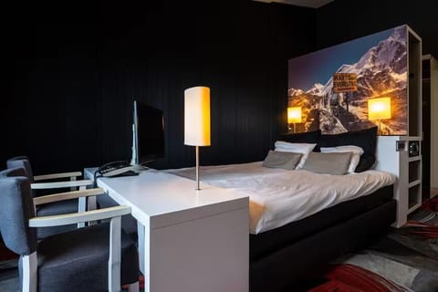 Sink into a bold, cozy room with warm ambient lighting.