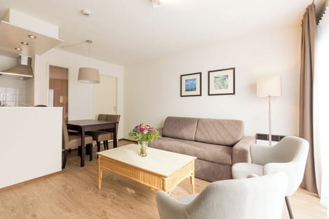 Lounge together on a cozy sofa after a day out.