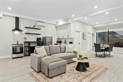 Open layout connecting living, dining, and kitchen for a seamless stay.