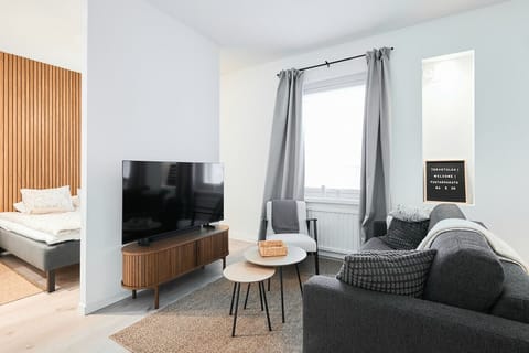 Unwind in the cozy lounge area, where large windows let in plenty of natural light for a bright and airy feel.