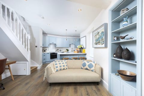 Open plan living, sofa, kitchen and work space - Myrtle Cottage