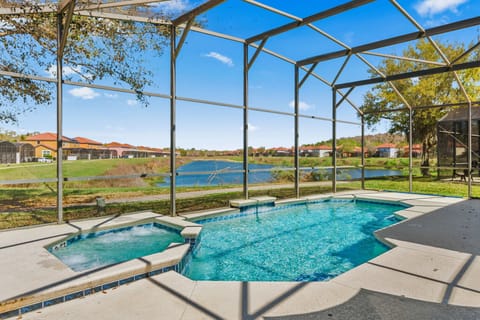 Relax in the screened pool and spa area with scenic lake views.