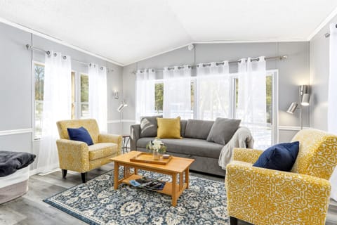 Open living room with expansive windows, perfect for relaxing in natural light.