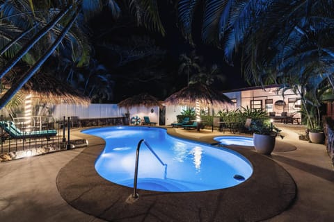 The softly illuminated pool invites you in for one last swim before calling it a night.