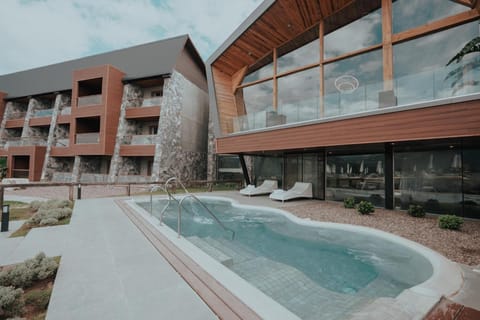 Step down into an epic infinity pool under wide skies.