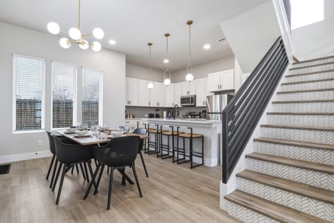 Spacious dining table that sits 6 with full tableware and silverware included.
