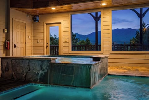 Large Pool Windows Overlooking The Mountains