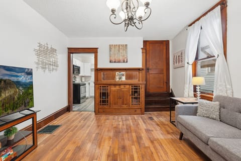 The spacious living room connects to the kitchen and to the larger king bedroom.