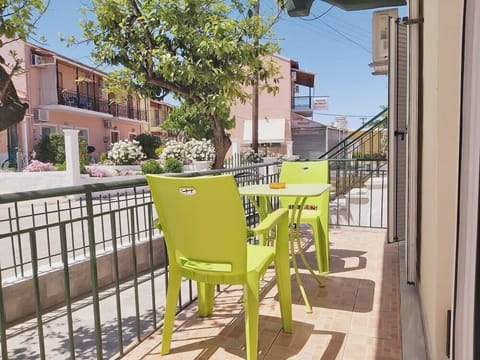 Private balcony with outdoor seating and neighborhood view!