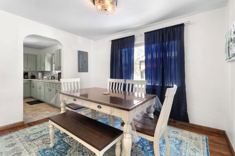 Cozy dining area with charming table and comfortable seating.