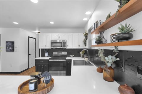 Modern, well-stocked kitchen with plenty of counter space—perfect for cooking big breakfasts and cozy cabin dinners.