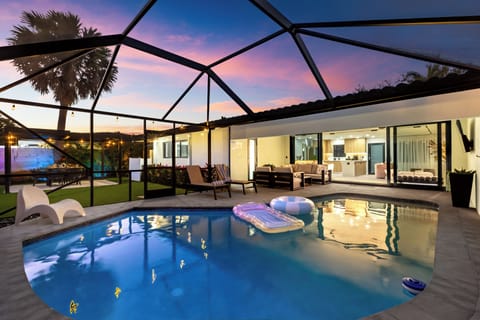 Private screened pool with seamless indoor-outdoor living.